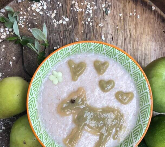 Pear banana kiwi puree on baby semolina porridge